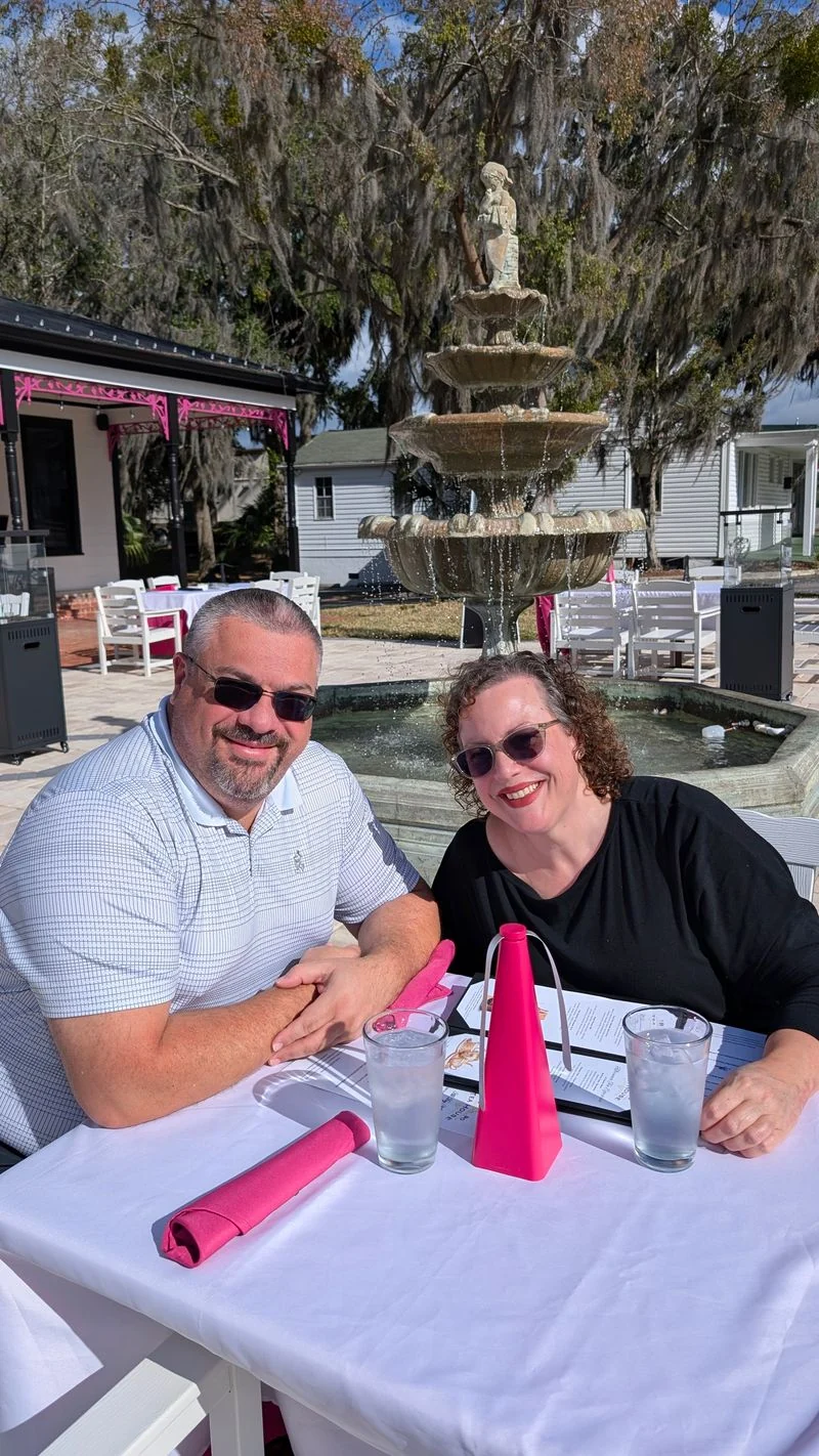 Guests seated at a patio table