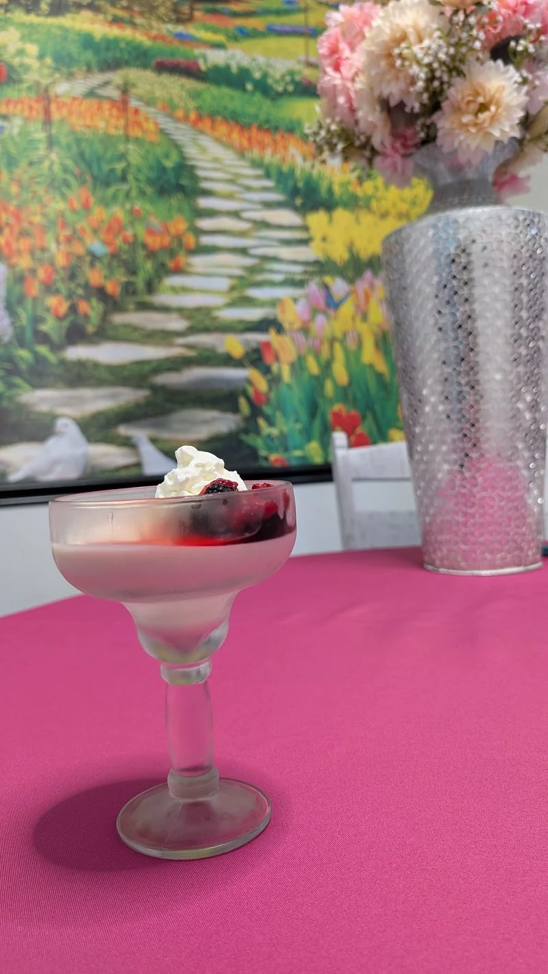 Pink specialty drink on an outdoor table
