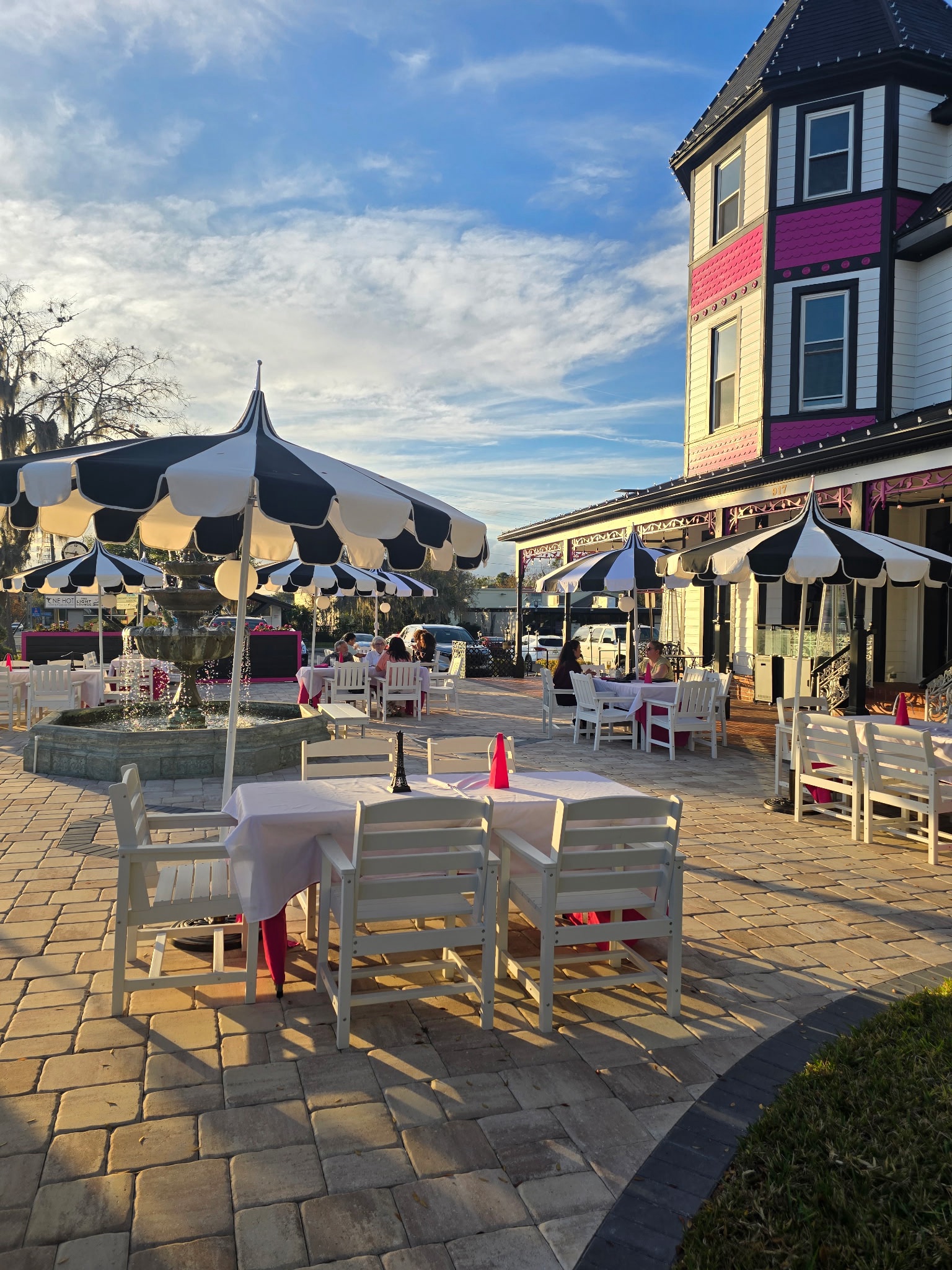 The black, white, and pink Tea House and patio